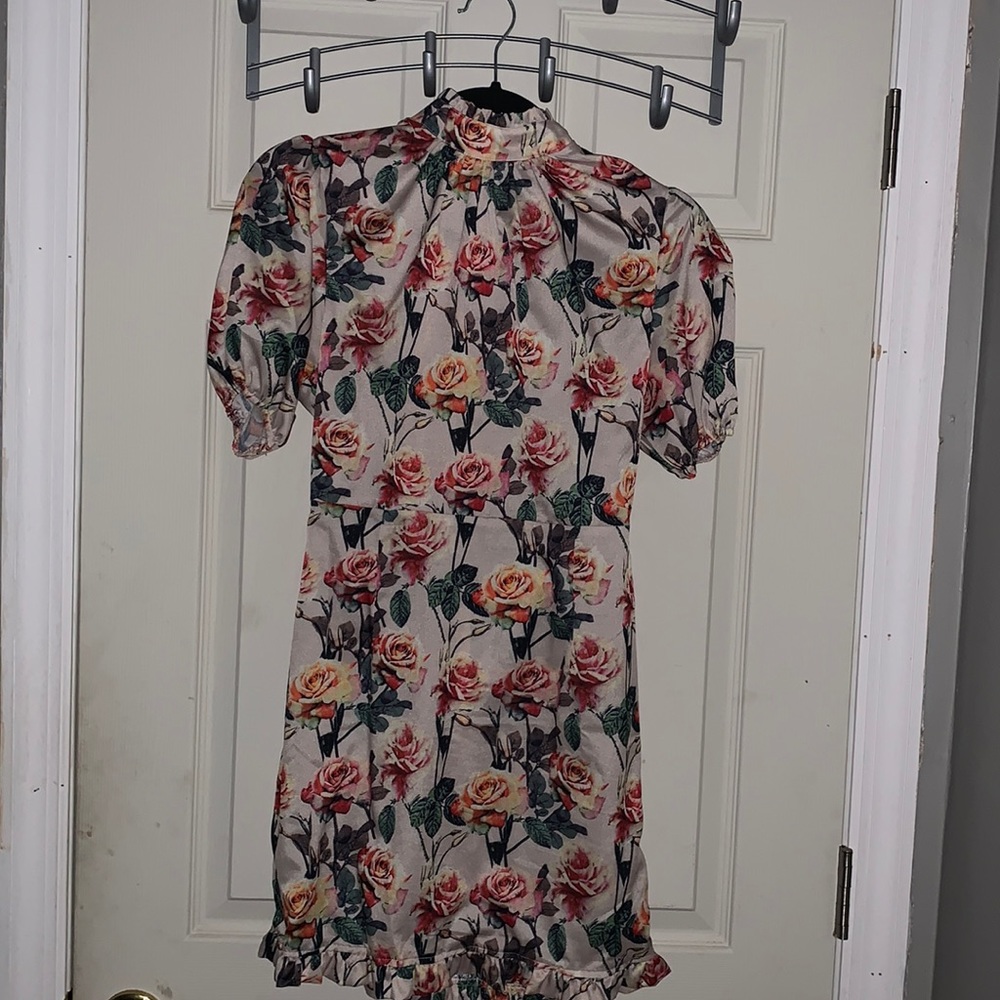 Cute floral body con fit dress.